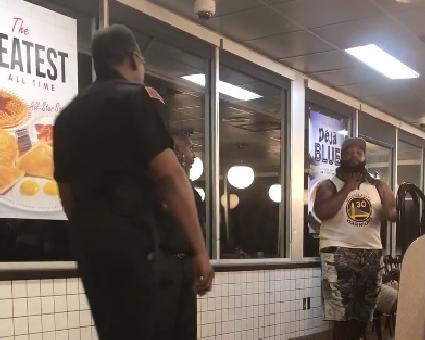 man with snake in waffle house