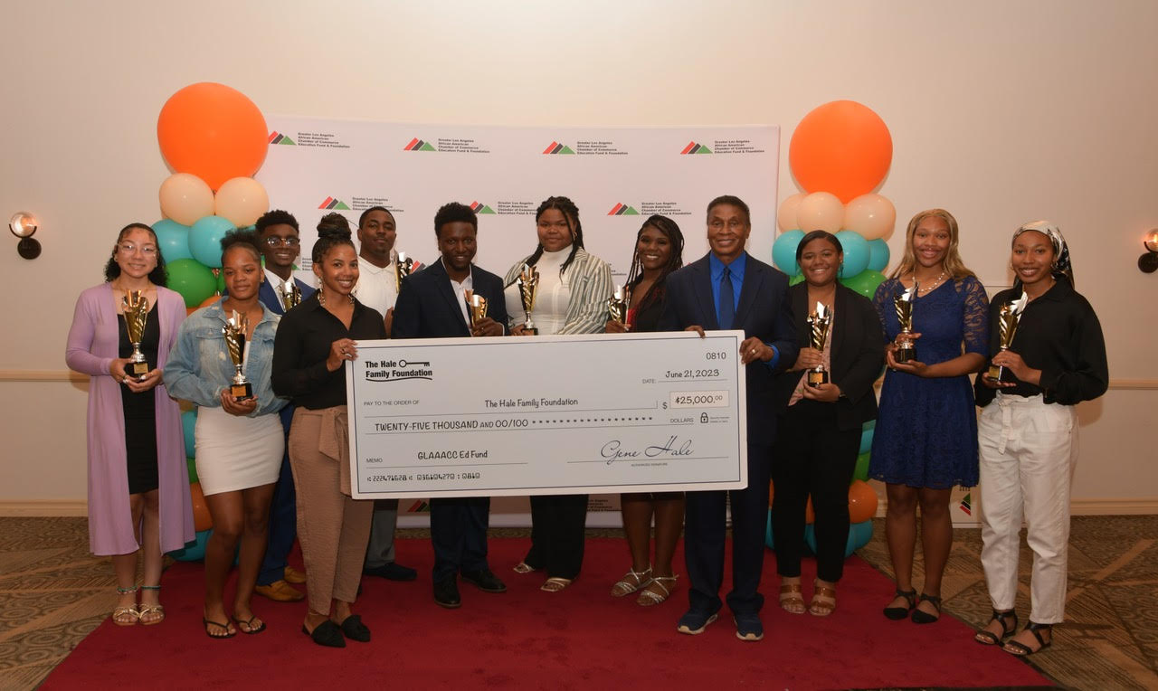 Crystal Hale and Gene Hale are holding the check in the center. Scholars L-R behind the check – Leah Sheffield, Hendra Benson, Hunter Langley, Jovon Reed-Brown, Chris Kariuki, Apriltroy Coleman, Heaven Watson, M'Kayla Weatherspoon, Neena Harris, and Aammarah Gage (courtesy photo)